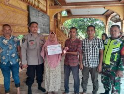 Polsek Nisam memberikan pengamanan kepada  masyarakat pada saat pengambilan BLT di Kecamatan Nisam