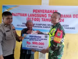 Bhabinkamtibmas Desa Seuneubok Aceh Monitoring dan Lakukan Pengamanan Penyaluran BLT-DD