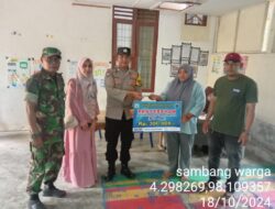 Lakukan Pengamanan, Bhabinkamtibmas Pastikan Kelancaran Penyaluran BLT di Desa Binaannya