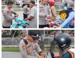 Kapolres Donggala Pimpin Pembagian Bendera Merah Putih di Tugu Adipura.