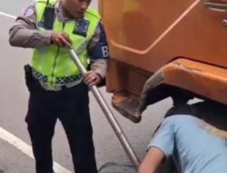 Di Bawah Mendung Jalan Ahmad Yani, Kepedulian Polantas Menjadi Cahaya.